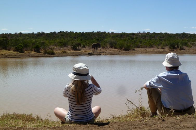 Sosian family watching elephants at acacia dam