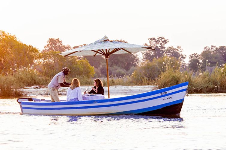 Tongabezi-Lodge-Activity-boat-dining-c_GS